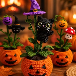 May include: Three crocheted potted plants featuring orange jack-o'-lantern bases. The center plant has a black cat with large eyes and a purple witch hat. Other plants include a purple pumpkin, a black bat, an orange pumpkin, and a red mushroom.