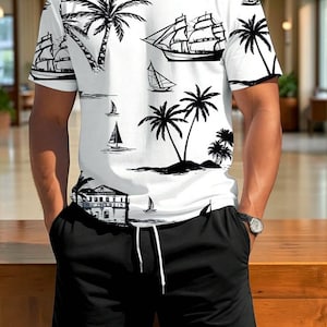 May include: White short-sleeved shirt and black shorts. The shirt features a black and white tropical design with palm trees, sailboats, and a building. The shorts have a drawstring and pockets. A watch is visible on the wrist.