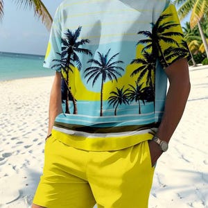 May include: A two-piece matching set featuring a short-sleeved t-shirt and shorts. The t-shirt has a beach scene print with palm trees and a blue and yellow color scheme. The shorts are solid yellow.