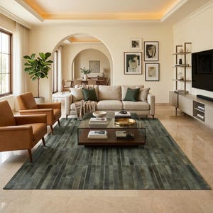 May include: A living room featuring a beige sofa with green throw pillows, two tan leather armchairs, and a rectangular glass-top coffee table. A large, dark green, striped area rug covers the floor, and a tall potted plant stands nearby.