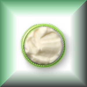 May include: A close-up of a white creamy substance in a green circle.