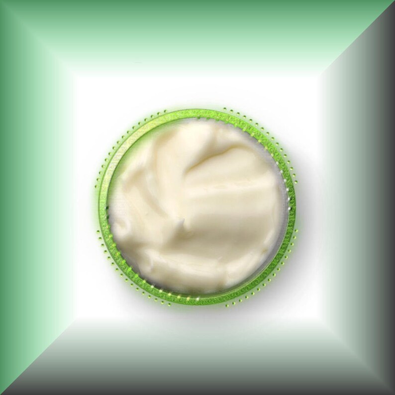May include: A close-up of a white creamy substance in a green circle.