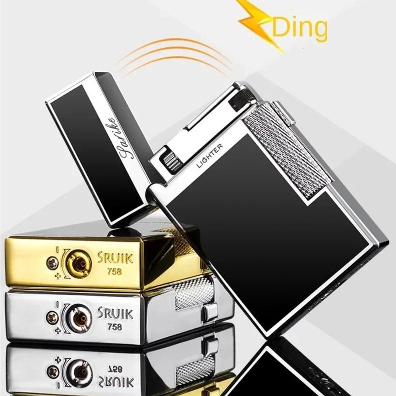 May include: A selection of rectangular lighters in gold, silver, and black. One lighter is open, showing a silver interior and the word "Lighter." The lighters are branded "SRUIK" with the number "758" printed on them.