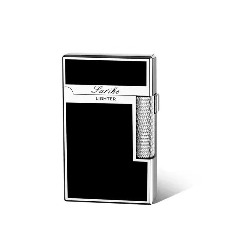 May include: A black and silver Sarike lighter. The lighter has a rectangular shape with a black front and top panel. The text "Sarike LIGHTER" is printed in a white, elegant font. The side has a textured silver design.
