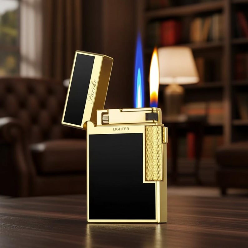 May include: A gold-coloured lighter with a black panel and the word "Lighter" printed on the front. The lighter is open, with a blue and orange flame. The word "Farike" is printed on the lid.
