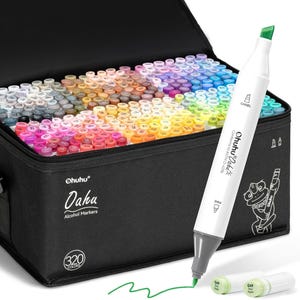 May include: A black carrying case filled with 320 Ohuhu Oahu alcohol markers in a rainbow of colors. A white marker with a green tip is in the foreground, with the text "Ohuhu Oahu" and "Alcohol Markers" visible on the case.