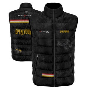 May include: A black quilted gilet featuring a high collar, a full-length front zip, and two zipped pockets. The gilet displays the text "SPYDER F3" and "OPEN YOUR ROAD" in yellow and white, along with a three-coloured stripe and a trike graphic.