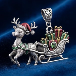 May include: A silver-toned Christmas pendant featuring a reindeer wearing a red Santa hat and pulling a sleigh filled with wrapped gifts. The sleigh has a green gemstone and is detailed with ornate scrollwork. The pendant has a decorative bail.