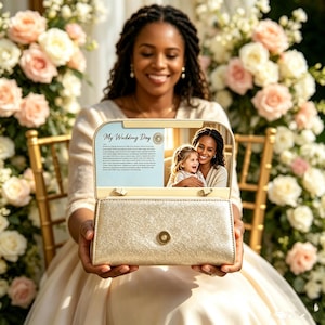 May include: A gold glitter clutch bag with a magnetic snap closure. The interior flap features the text My Wedding Day and a photograph of an adult and a child. The exterior has a textured, shimmering gold finish and a rectangular structure.
