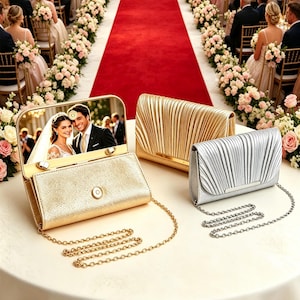 May include: Three rectangular clutch bags with metallic finishes and thin chain straps. One gold clutch features an open lid displaying a photograph of a bride and groom. The other two clutches, one gold and one silver, have pleated front flaps.