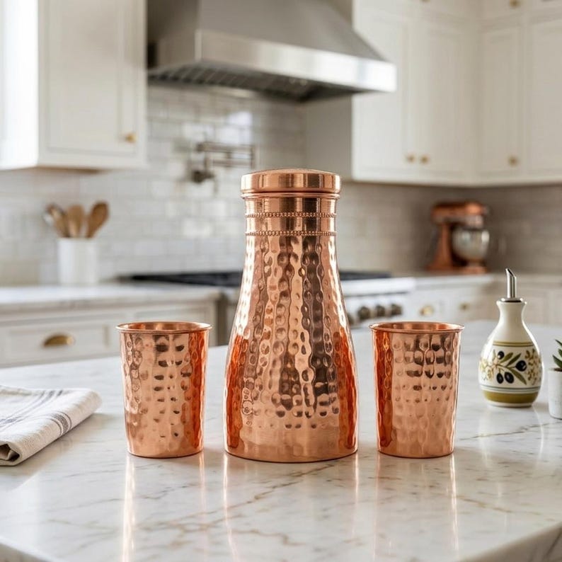May include: A set of three ceramic mugs with a speckled, matte finish. The mugs are in shades of cream, light gray, and dark gray. Each mug has a simple, minimalist design and a rounded handle.