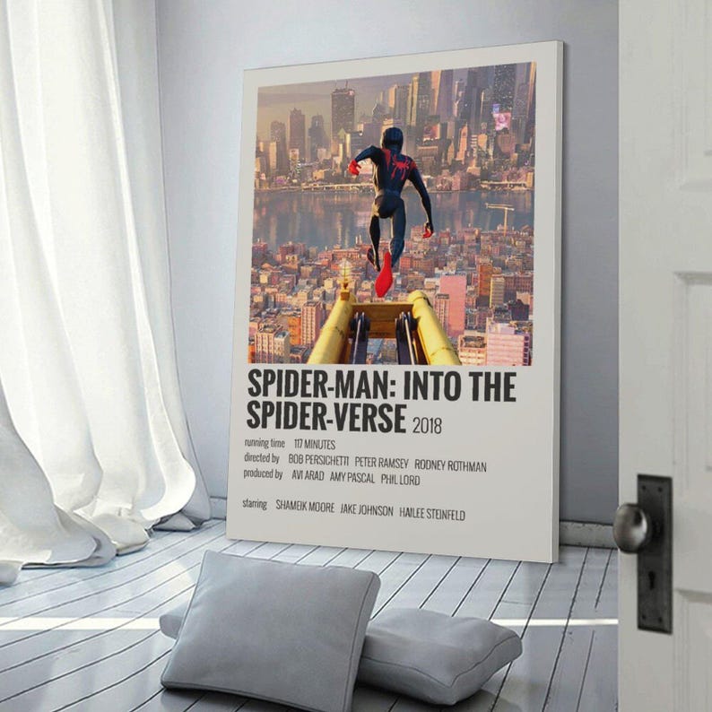 May include: A framed poster for the animated film "Spider-Man: Into the Spider-Verse" featuring a cityscape background and a figure of Spider-Man in mid-air. The poster includes the film's title, year, and credits.
