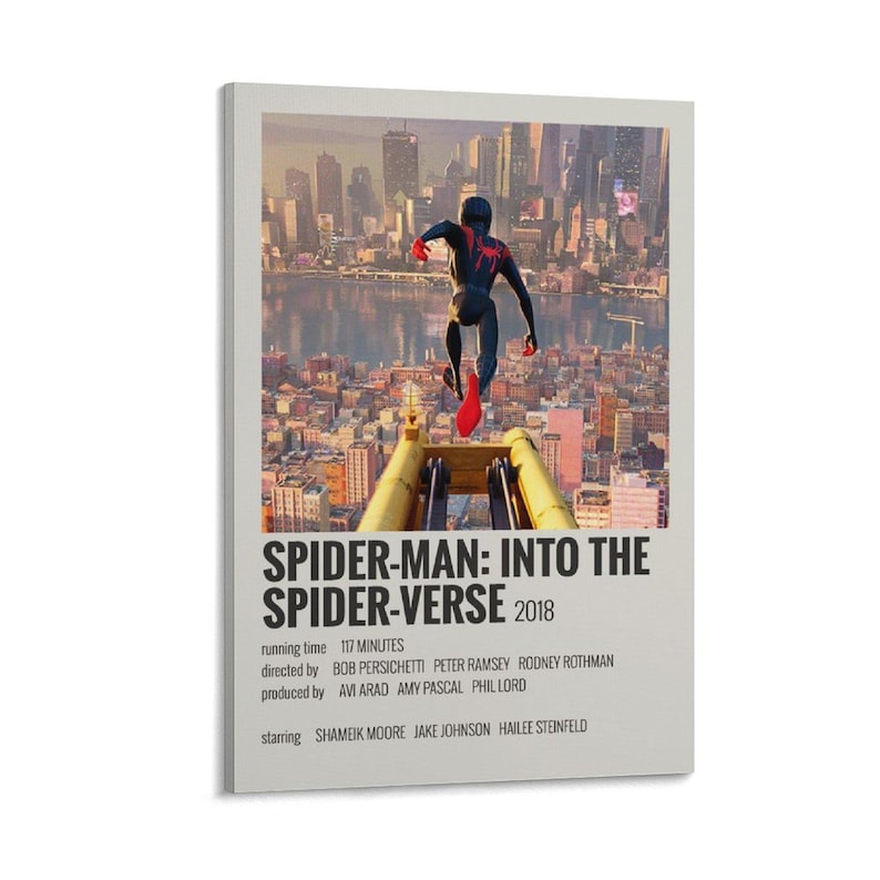 May include: A framed movie poster for "Spider-Man: Into the Spider-Verse" featuring a cityscape backdrop. The poster shows Spider-Man in a black and red suit leaping from a structure. The title and credits are displayed in a minimalist style.