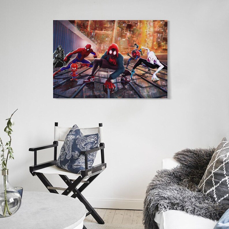 May include: A canvas print featuring multiple Spider-Man characters in action poses against a cityscape backdrop. The artwork showcases vibrant colors and dynamic compositions, with the characters in their iconic costumes.