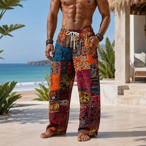 May include: Loose-fitting trousers featuring a vibrant patchwork design with various geometric and floral patterns in shades of red, orange, blue, yellow, and purple. The pants include an elastic waistband with a white drawstring and side pockets.