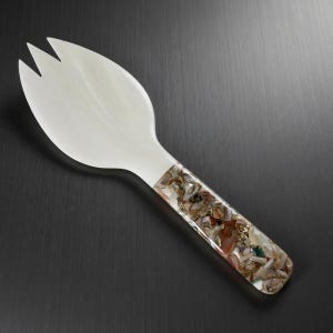 May include: A trio of speckled ceramic mugs in cream, light grey, and dark grey. Each mug has a minimalist design, a matte finish, and a rounded handle. Ideal for tea or coffee.