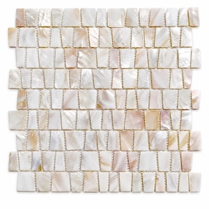 May include: A square mosaic tile sheet composed of individual, irregularly shaped pieces of iridescent white and pale pink mother-of-pearl. The pieces are arranged in a grid pattern with visible grout lines between each shell segment.