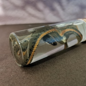 May include: A set of three ceramic nesting bowls in shades of blue, green, and white. The bowls have a speckled glaze and a simple design. The largest bowl is approx. 18 cm in diameter.