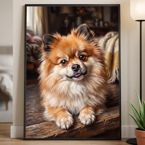 Pode incluir: Uma impressão de arte de parede emoldurada com o retrato de um cão Lulu da Pomerânia de pelo fofo em tons de castanho-dourado e creme. O cão é mostrado do peito para cima, apoiando as patas dianteiras numa superfície de madeira, com fundo desfocado.