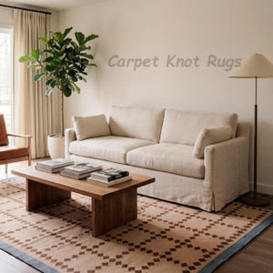 May include: A living room scene featuring a beige sofa, a wooden coffee table with books, and a patterned rug. A tall plant in a white pot and a floor lamp add to the decor. The text "Carpet Knot Rugs" is visible.