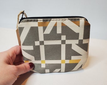 Cartera pequeña con cremallera reciclada: diseño geométrico