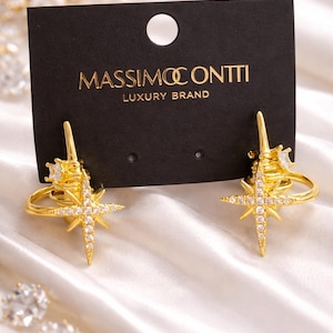 Pendientes con amuleto de la rosa de los vientos de Massimo Contti