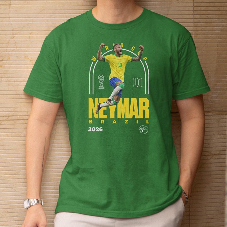 A green t-shirt with a graphic design featuring a soccer player in yellow and blue, along with the text "Neymar Brazil" and the year "2026".