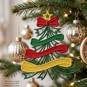 May include: A Christmas tree-shaped ornament made of green embroidery thread, featuring a yellow star at the top, a red bow, and three horizontal ribbons in green, red, and yellow. The ornament hangs from a gold string on a pine tree branch.