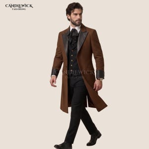 May include: A brown long coat with black lapels and cuffs, worn over a black waistcoat with gold buttons, a black cravat, and black trousers. The text CANDLEWICK TAILORING appears in the top left corner. The outfit is worn by a person with dark hair.