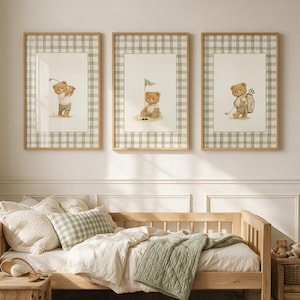 May include: A set of three framed wall art prints featuring illustrations of brown teddy bears playing golf. Each print is encased in a light wood frame and displays a sage green and white gingham border surrounding the central bear artwork.