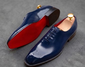 Zapatos Oxford de cuero azul marino hechos a mano con punta cuadrada para ocasiones formales.