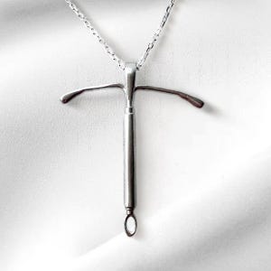 handcrafted-iud-pendant-necklace-with-gold-and-silver-metal-variations