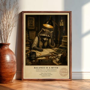 May include: A framed print featuring a raccoon in a shirt and suspenders, looking stressed at a desk. The print includes text that reads "Excel is my love language" and "Balance is a myth." A coffee mug and calculator are also visible.