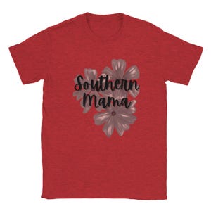 May include: Red t-shirt with the text "Southern Mama" in a cursive font, accompanied by a floral design in shades of gray. The shirt is made of a soft material and has short sleeves.