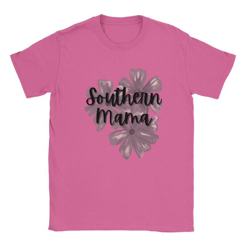 May include: A pink t-shirt featuring the text "Southern Mama" in a cursive font, with a floral design in gray. The shirt is made of a soft material and has short sleeves.