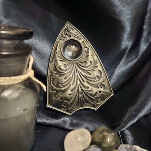 May include: A set of three ceramic mugs with a speckled, matte finish in cream, light grey, and dark grey. Each mug has a simple, minimalist design and a rounded handle.