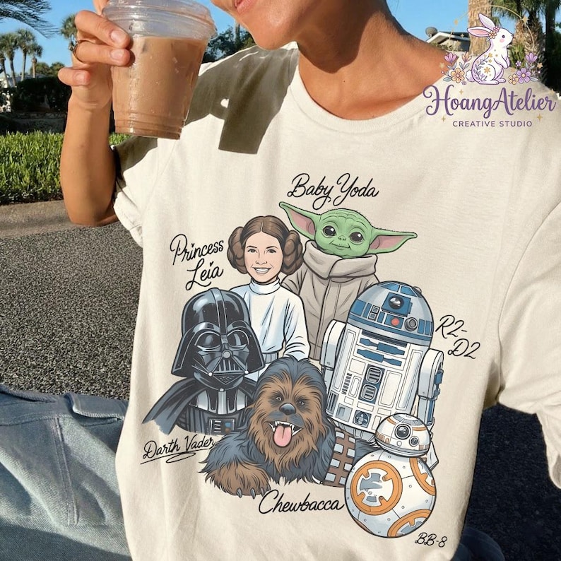 May include: A white ceramic mug with a black handle and the text "But First, Coffee" in a black, bold font. The mug is on a white surface.