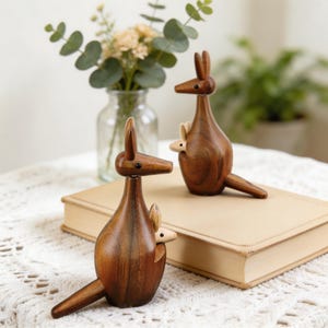 Mother and baby kangaroo decor in natural wood for nursery shelf styling
