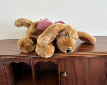 Dog brown laying 12” plush with burgundy bow at VelmasVintageToys
