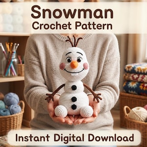 May include: A white crocheted snowman toy with a carrot-shaped nose, black button eyes, a wide smile, and three black buttons on its torso. The snowman has brown twig-like arms and hair. Text reads: Snowman Crochet Pattern and Instant Digital Download.