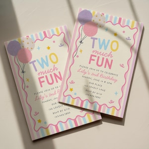 May include: Two rectangular birthday invitation cards featuring a pastel striped border, a wavy pink frame, and illustrations of balloons and stars. The text reads: TWO much FUN, PLEASE JOIN US TO CELEBRATE, Lily's 2nd Birthday, SUNDAY, JUNE 14 @ 2PM, OUR PLACE, 126 LOVELY LANE, RSVP BY 6/10, 123.456.7890.