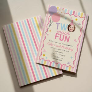 May include: A rectangular birthday invitation card featuring a pastel striped background and a scalloped border. The text reads TWO MUCH FUN, Lily's 2nd Birthday, Sunday, June 14 at 2pm, Our Place, 126 Lovely Lane, RSVP by 6/10, 123.456.7890.