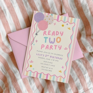May include: A rectangular birthday invitation card with a cream background, featuring a pink scalloped border and pastel striped edges. The text reads READY TWO PARTY, LILY'S 2ND BIRTHDAY, and event details. Three balloons and small stars decorate the card.