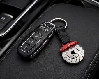 Llavero para coche Audi Sport con forma de disco de freno, de cuero y metal, estilo deportivo. Accesorio para coche, regalo para conductor.