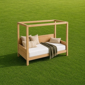May include: A light-toned wooden canopy daybed featuring a white mattress, a solid back panel, and four vertical posts. The bed is styled with two beige throw pillows with subtle vertical stripes, one small rectangular beige pillow, and a dark olive throw.