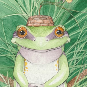 May include: A green frog wearing a woven basket on its head, smiling and looking at the viewer. The frog is surrounded by green foliage and a yellow butterfly is perched on a leaf.