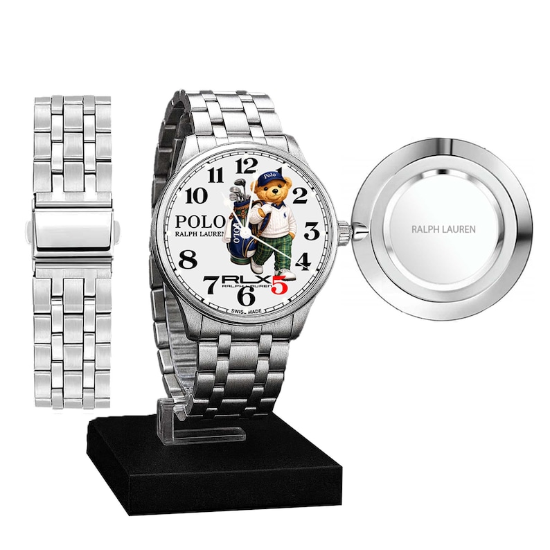 May include: A silver wristwatch with a white face featuring a Polo bear graphic. The watch has a stainless steel band and a separate band piece. The watch face displays the Polo Ralph Lauren logo and the text "RLX". The watch is displayed on a black stand.