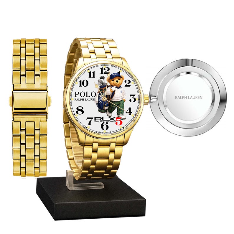 May include: Gold-plated wristwatch with a white face featuring a Polo bear in a golf outfit. The watch has a gold band and a separate band piece. The watch is displayed on a black stand, with a silver-toned back piece. The watch face displays the text "POLO RALPH LAUREN".