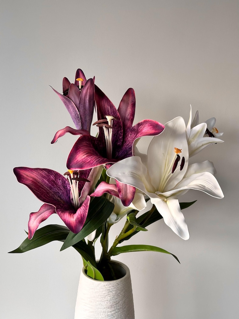 artificial lilies in purple and white colours