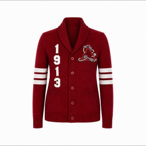 May include: A deep red shawl collar cardigan featuring white stripes on the sleeves, the number 1913 in white on the right chest, and a triangular emblem decorated with white pearls and small purple flowers on the left chest, with five buttons.
